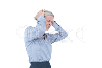 Worried businesswoman holding her head