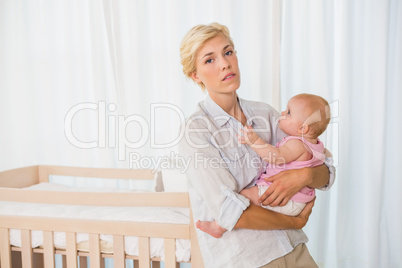 Beauitiful woman holding her baby girl