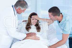 Pregnant woman having birth pangs