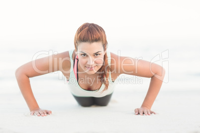 Beautiful brunette doing push ups