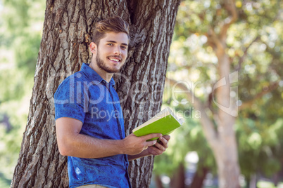 Young man reading a book