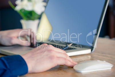 Close up of businessman working at desk