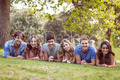 Friends lying and talking in the park