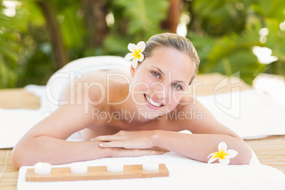 Peaceful blonde lying on towel