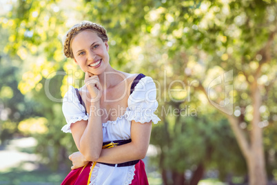 Pretty oktoberfest blonde smiling in the park