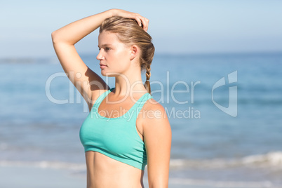 Beautiful fit woman relaxing at the beach