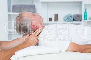 Man receiving neck massage