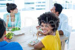 Smiling businesswoman having lunch