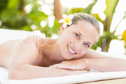 Peaceful blonde lying on towel