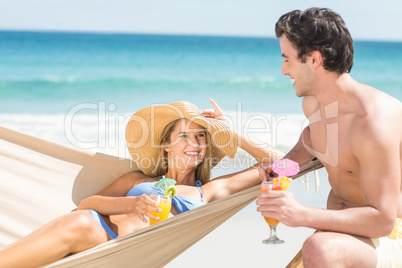 Happy couple holding cocktail