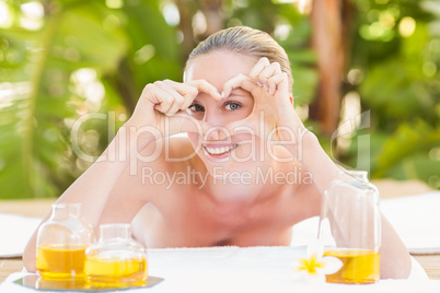 Peaceful blonde lying on towel