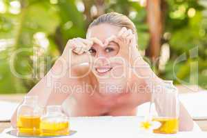 Peaceful blonde lying on towel