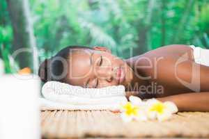 Beautiful woman lying on massage table