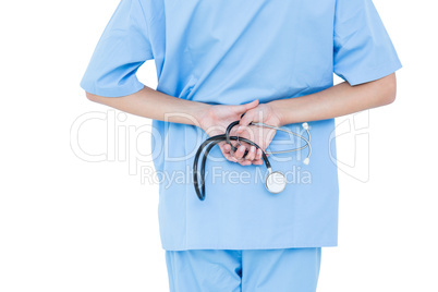 Concentrated doctor standing with stethoscope