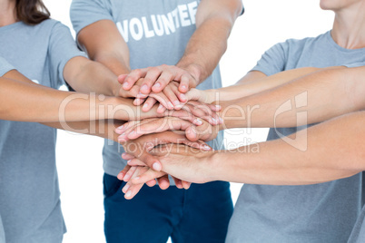Volunteers friends putting their hands together
