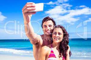 Happy couple taking selfie