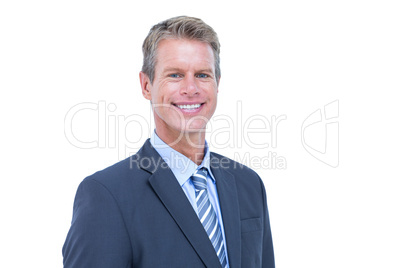 Smiling businessman against a white background