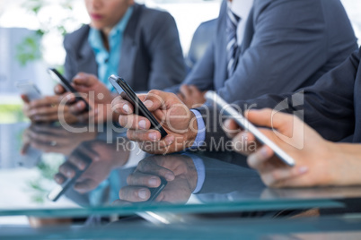 Business team using their mobile phone