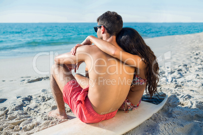 happy couple with surfboard on a sunny day happy couple with surfboard on a sunny day