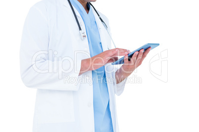 Standing doctor using his tablet
