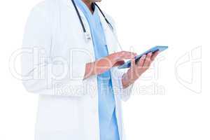 Standing doctor using his tablet