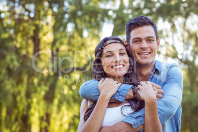 Cute couple smiling in the park