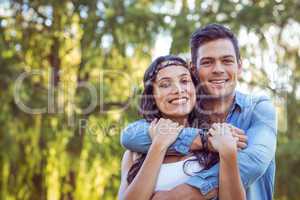 Cute couple smiling in the park