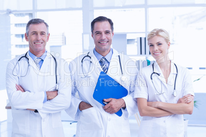 Smiling doctors looking at camera