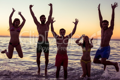 Happy friends having fun in the water