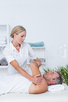 Doctor examining her patient arm