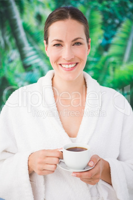 A beautiful young woman drinking a coffee