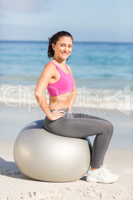 Fit woman doing fitness on exercise ball