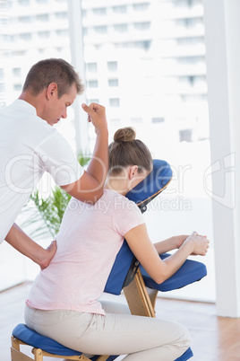 Woman having back massage