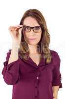 Pretty woman with glasses looking at camera