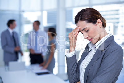 Worried businesswoman with head in one hand