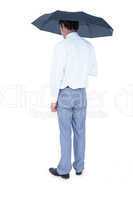 Rear view of businessman holding an umbrella