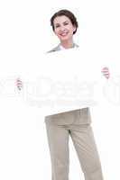 Smiling businesswoman holding blank sign