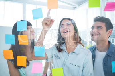 Young creative business people looking at photo editor