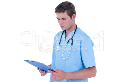 A young nurse reading notes A young nurse reading notes
