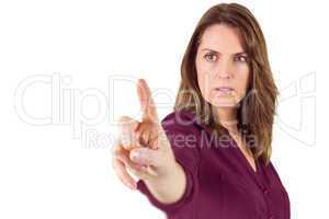 Serious woman pointing her finger at camera