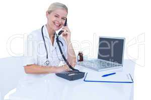 Smiling doctor having a phone call