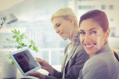 Smiling businesswomen at camera