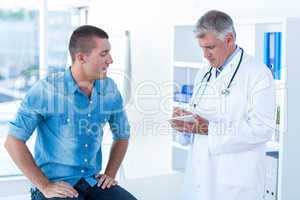 Doctor writing treatment for his patient