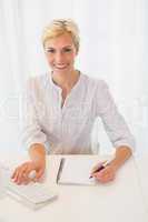 Portrait smiling blonde woman using computer