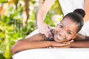Beautiful woman receiving massage at health farm