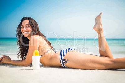 Pretty brunette posing at the beach