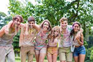 Happy friends covered in powder paint