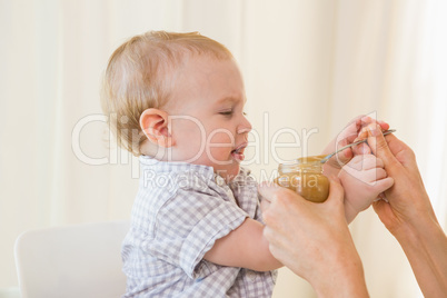Very beautiful baby boy eating