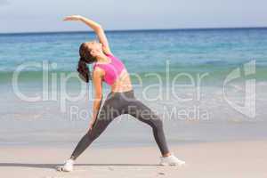 Fit woman stretching her back