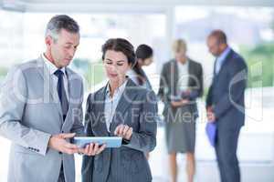 Businesswoman showing the tablet